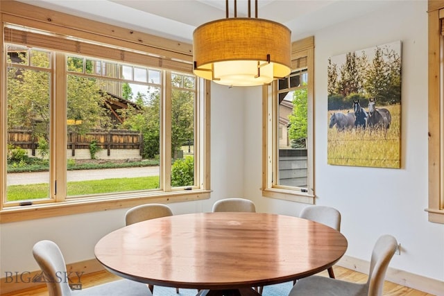 99 Pheasant Tail Ln Unit 1, Big Sky, MT 59716 - dining area featuring wood finished floors and baseboards