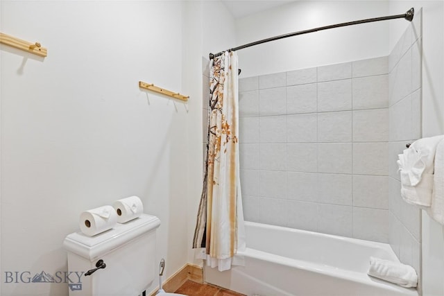 99 Pheasant Tail Ln Unit 1, Big Sky, MT 59716 - bathroom featuring toilet and shower / tub combo with curtain