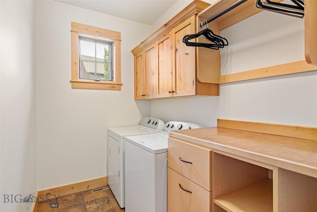 99 Pheasant Tail Ln Unit 1, Big Sky, MT 59716 - washroom with cabinet space, washing machine and dryer, and stone finish floors
