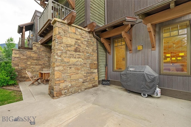 99 Pheasant Tail Ln Unit 1, Big Sky, MT 59716 - view of patio featuring a grill