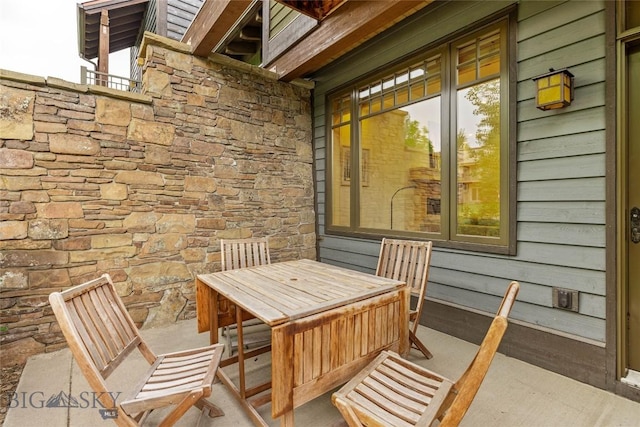 99 Pheasant Tail Ln Unit 1, Big Sky, MT 59716 - view of patio / terrace with outdoor dining area