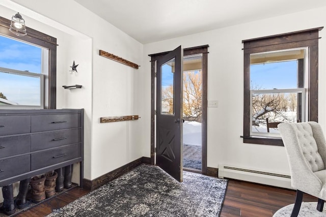 12977 Cottonwood Rd, Bozeman, MT 59718 - entrance foyer featuring a baseboard radiator, wood finished floors, and healthy amount of natural light