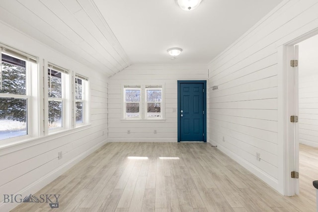 12977 Cottonwood Rd, Bozeman, MT 59718 - unfurnished sunroom with healthy amount of natural light and vaulted ceiling
