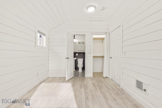 12977 Cottonwood Rd, Bozeman, MT 59718 - hall with light wood-style flooring, wood walls, and lofted ceiling