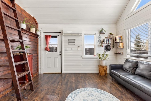 12977 Cottonwood Rd, Bozeman, MT 59718 - living area featuring a wall unit AC, wood-type flooring, and lofted ceiling
