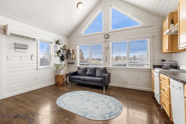 12977 Cottonwood Rd, Bozeman, MT 59718 - sitting room with lofted ceiling, dark wood finished floors, wood walls, and a wall unit AC