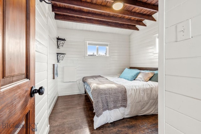 12977 Cottonwood Rd, Bozeman, MT 59718 - bedroom featuring a wooden ceiling with exposed beams, dark wood-style floors, and wood walls