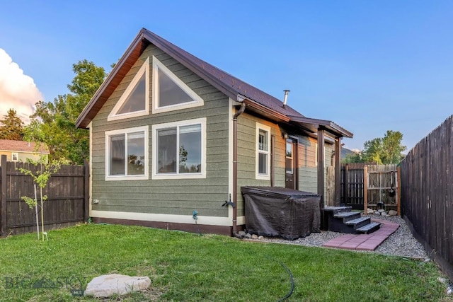 12977 Cottonwood Rd, Bozeman, MT 59718 - rear view of house with a fenced backyard
