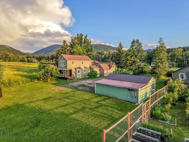 12977 Cottonwood Rd, Bozeman, MT 59718 - view of grassy yard with a mountain view and an outdoor structure