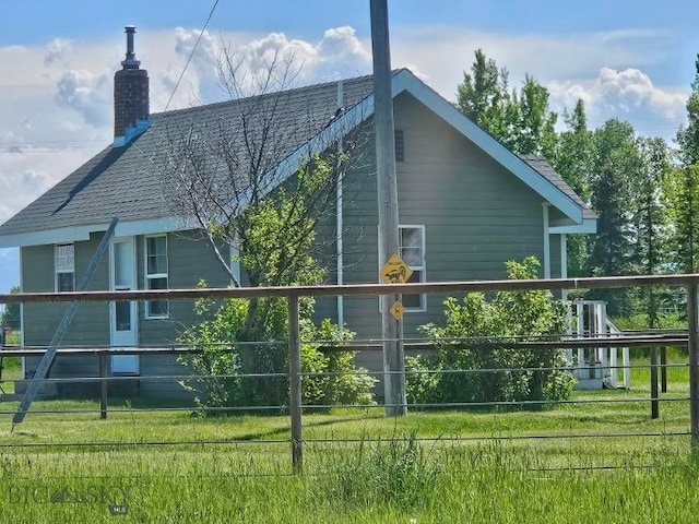 view of side of property with a chimney