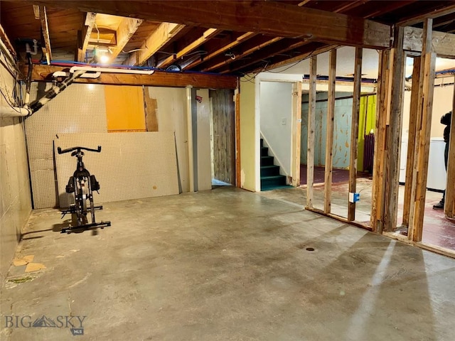 1001 Utah Ave, Butte, MT 59701 - unfinished below grade area featuring stairs and washer / clothes dryer