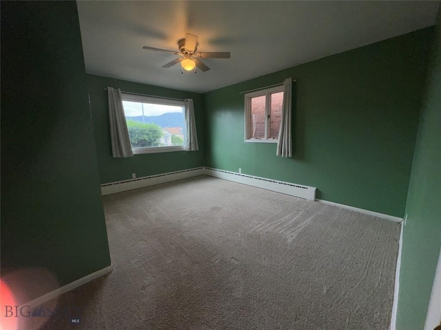 1001 Utah Ave, Butte, MT 59701 - unfurnished room with ceiling fan, a baseboard radiator, and carpet floors