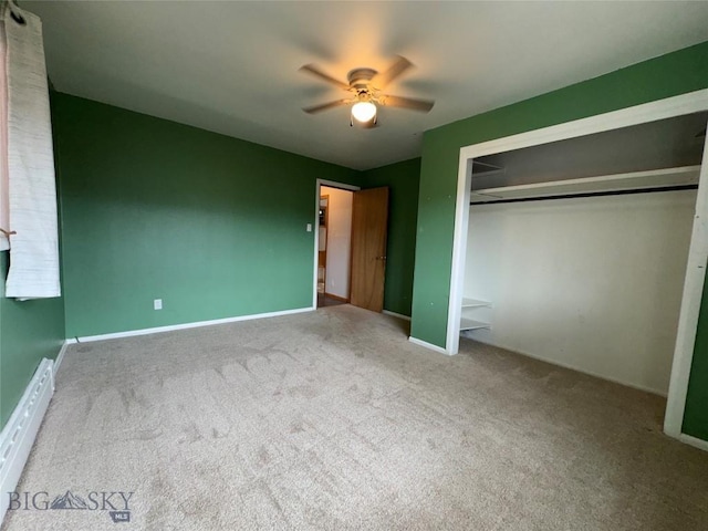 1001 Utah Ave, Butte, MT 59701 - unfurnished bedroom featuring carpet, a baseboard heating unit, a closet, and a ceiling fan