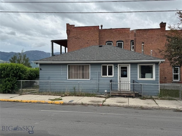 1001 Utah Ave, Butte, MT 59701 - view of front facade featuring a mountain view and roof with shingles