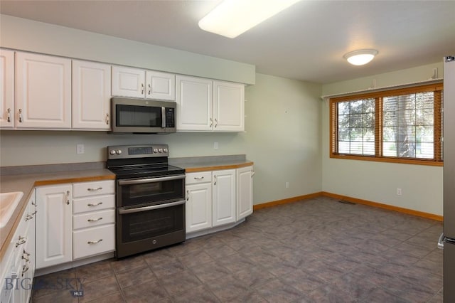 2400 Durston Rd Unit 17, Bozeman, MT 59718 - kitchen featuring stainless steel appliances, white cabinetry, and light countertops