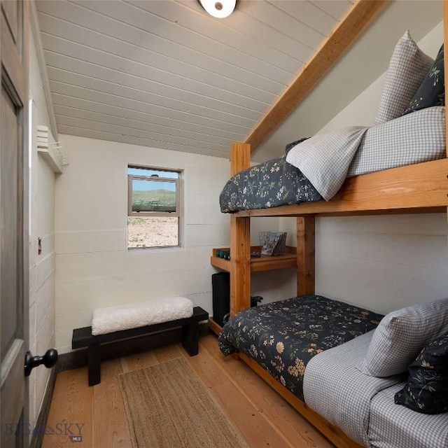 73 W Baker Ln S, Twin Bridges, MT 59754 - bedroom featuring wood finished floors and lofted ceiling