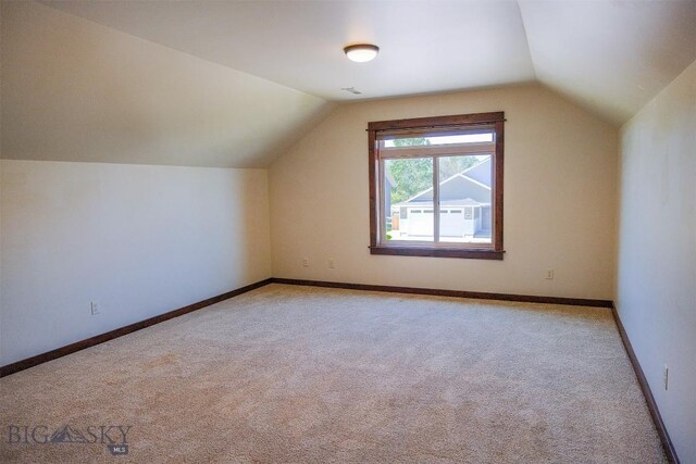 3230 S 26th Ave, Bozeman, MT 59718 - additional living space featuring light carpet and vaulted ceiling