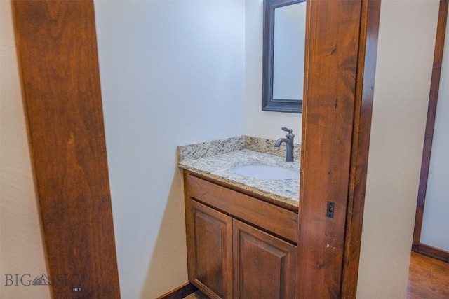 3230 S 26th Ave, Bozeman, MT 59718 - bathroom with vanity and wood finished floors