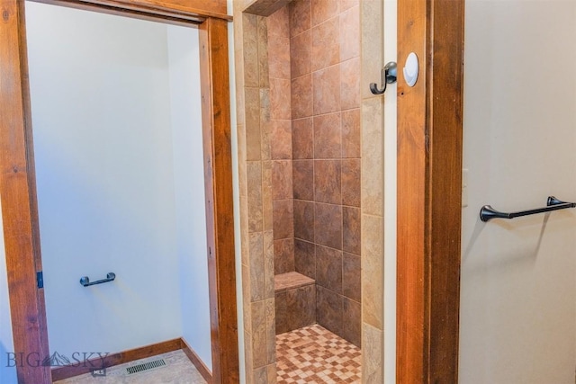 3230 S 26th Ave, Bozeman, MT 59718 - bathroom featuring a tile shower and baseboards