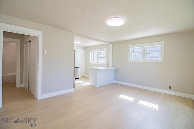 1940 Locust, Butte, MT 59701 - spare room featuring light wood finished floors and baseboards