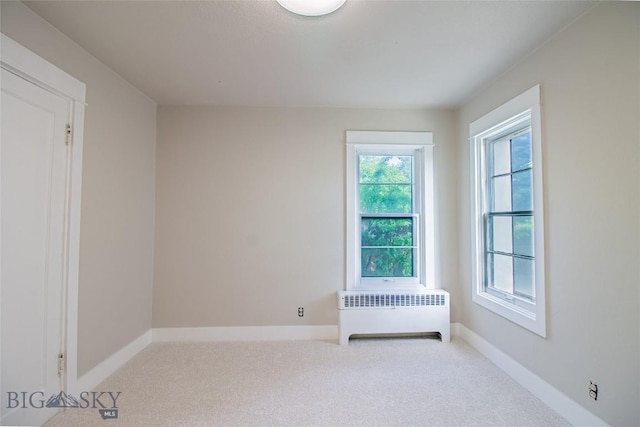 1940 Locust, Butte, MT 59701 - carpeted spare room featuring radiator and baseboards