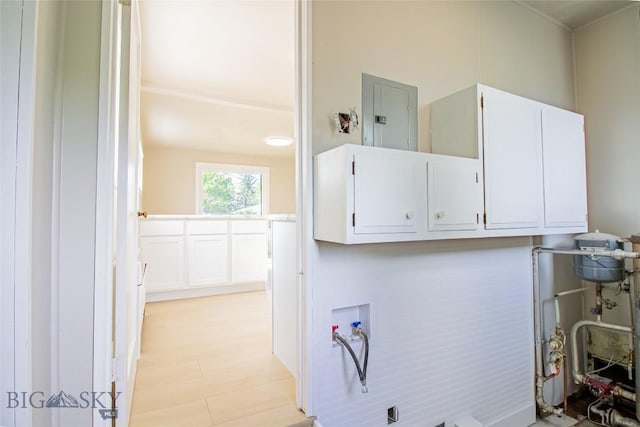 1940 Locust, Butte, MT 59701 - washroom with cabinet space, hookup for a washing machine, electric panel, and light wood-style floors