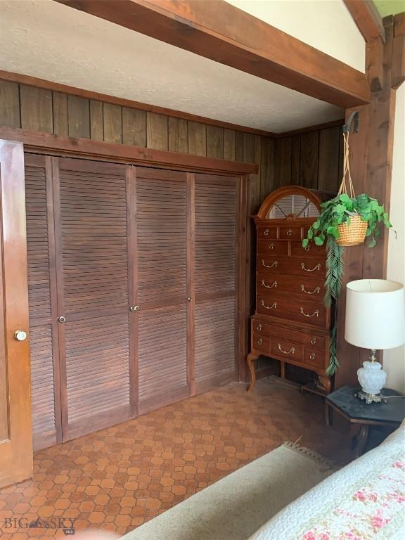 1813 Adams Ave, Butte, MT 59701 - bedroom featuring wood walls and a closet