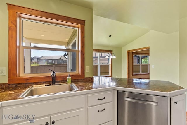 901 Floyd Way, Livingston, MT 59047 - kitchen with stainless steel dishwasher, tile countertops, a peninsula, white cabinets, and vaulted ceiling