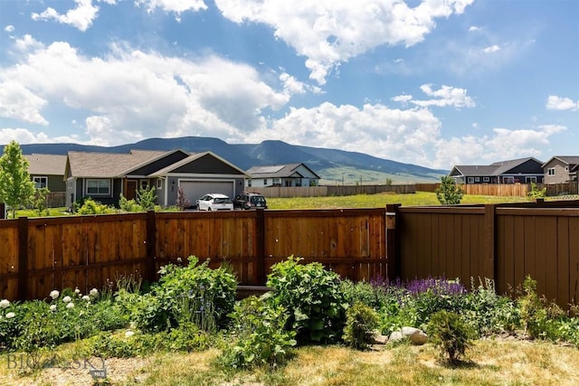 901 Floyd Way, Livingston, MT 59047 - view of yard with a residential view, a mountain view, and an attached garage