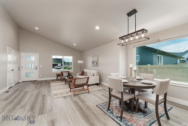 2204 Oriole Dr, Belgrade, MT 59714 - dining area with light wood-style flooring, recessed lighting, and high vaulted ceiling