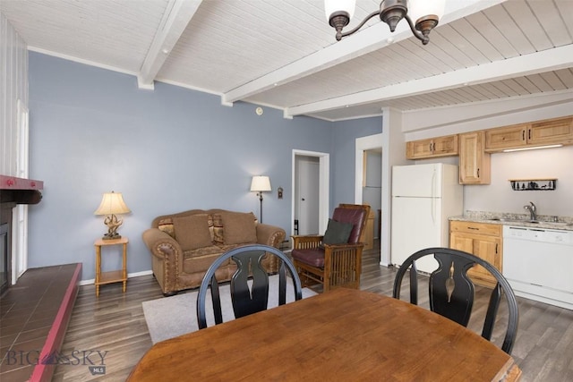139 Spruce Cone Dr Unit 14, Big Sky, MT 59716 - dining space featuring beamed ceiling, dark wood-type flooring, and a large fireplace