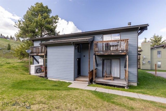139 Spruce Cone Dr Unit 14, Big Sky, MT 59716 - back of house with a balcony, a yard, and a deck