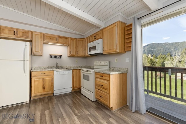 139 Spruce Cone Dr Unit 14, Big Sky, MT 59716 - kitchen with white appliances, wood ceiling, dark wood finished floors, light stone countertops, and a mountain view