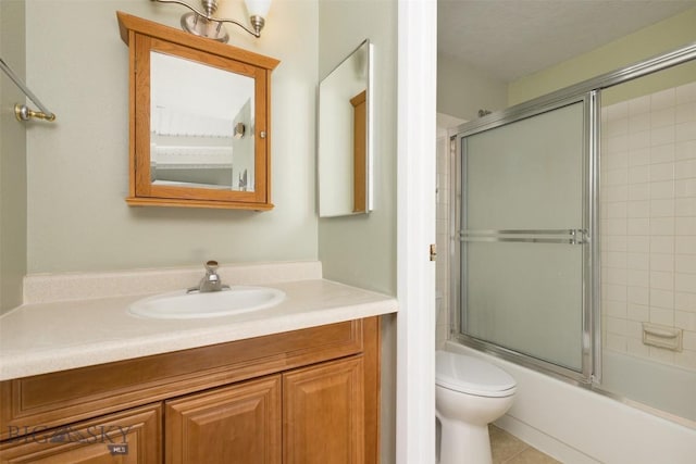 139 Spruce Cone Dr Unit 14, Big Sky, MT 59716 - full bathroom featuring vanity, bath / shower combo with glass door, and tile patterned floors