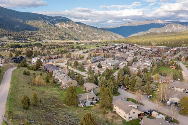 139 Spruce Cone Dr Unit 14, Big Sky, MT 59716 - aerial view of property's location with a mountain backdrop and nearby suburban area