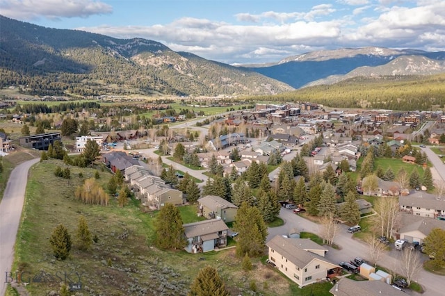 139 Spruce Cone Dr Unit 14, Big Sky, MT 59716 - aerial overview of property's location featuring mountains and nearby suburban area