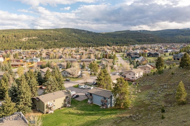139 Spruce Cone Dr Unit 14, Big Sky, MT 59716 - view of property location featuring nearby suburban area and a forest