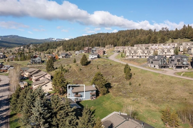 139 Spruce Cone Dr Unit 14, Big Sky, MT 59716 - aerial perspective of suburban area with a forest and mountains