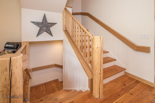2500 Little Coyote Rd Unit 34, Big Sky, MT 59716 - staircase featuring wood finished floors and baseboards