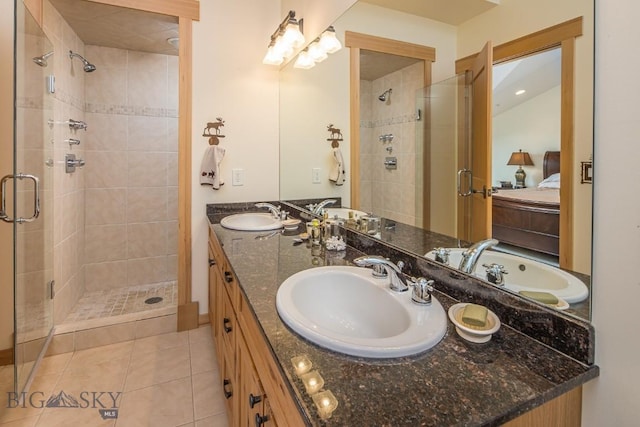 2500 Little Coyote Rd Unit 34, Big Sky, MT 59716 - ensuite bathroom with a shower stall, double vanity, and tile patterned flooring