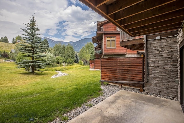 2500 Little Coyote Rd Unit 34, Big Sky, MT 59716 - view of grassy yard with a mountain view