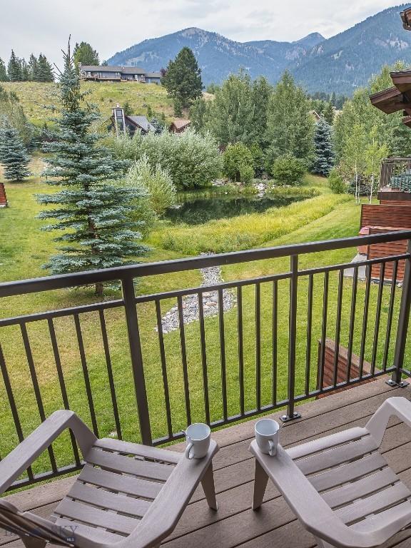 2500 Little Coyote Rd Unit 34, Big Sky, MT 59716 - balcony featuring a mountain view