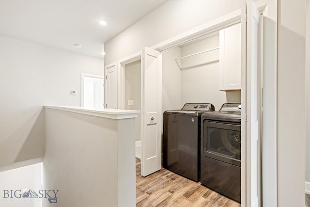 6707 Blackwood Rd Unit C, Bozeman, MT 59715 - washroom featuring washer and clothes dryer, cabinet space, light wood-type flooring, and recessed lighting