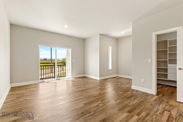 6707 Blackwood Rd Unit C, Bozeman, MT 59715 - unfurnished room featuring wood finished floors and recessed lighting