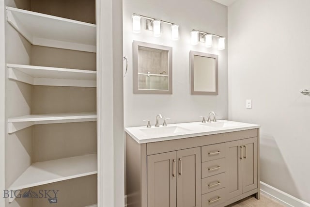 6707 Blackwood Rd Unit C, Bozeman, MT 59715 - bathroom featuring double vanity and baseboards