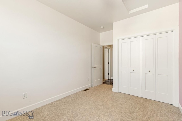 6707 Blackwood Rd Unit C, Bozeman, MT 59715 - unfurnished bedroom featuring light carpet and a closet