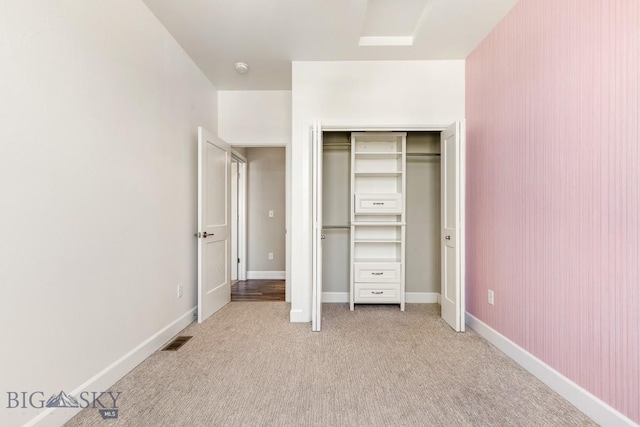 6707 Blackwood Rd Unit C, Bozeman, MT 59715 - unfurnished bedroom featuring light carpet and a closet