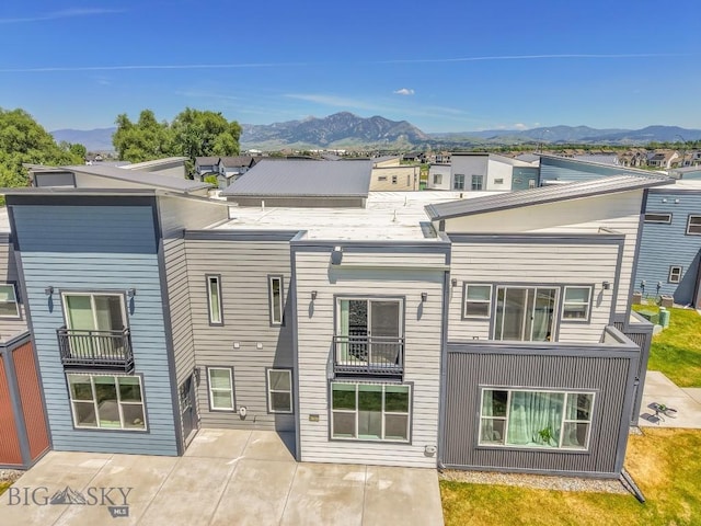6707 Blackwood Rd Unit C, Bozeman, MT 59715 - back of house featuring a mountain view and a patio area