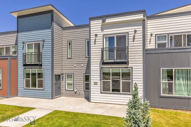 6707 Blackwood Rd Unit C, Bozeman, MT 59715 - view of front of home featuring a patio and a front yard