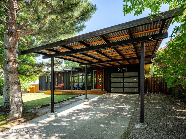 1206 N Cedarview Dr, Bozeman, MT 59715 - view of patio / terrace with a carport, an attached garage, and driveway